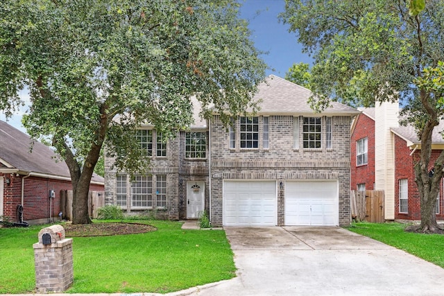 view of front facade with a front yard and a garage