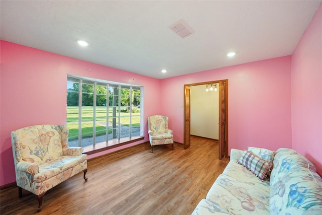 sitting room featuring hardwood / wood-style floors