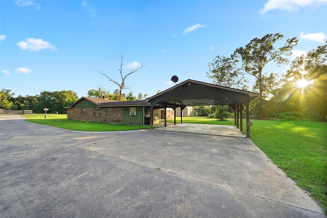 view of front facade with a carport and a front yard