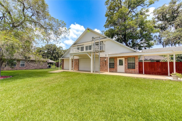 view of front of home with a garage, a front lawn, and a balcony