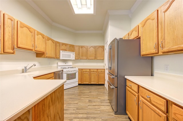 kitchen featuring crown molding, sink, white appliances, and light hardwood / wood-style flooring