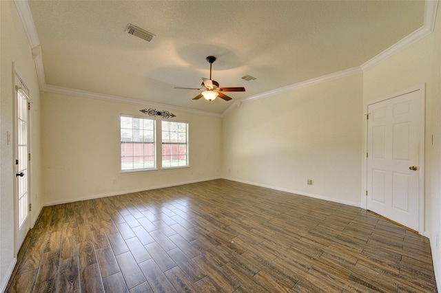 empty room with dark wood-type flooring, ornamental molding, and a textured ceiling