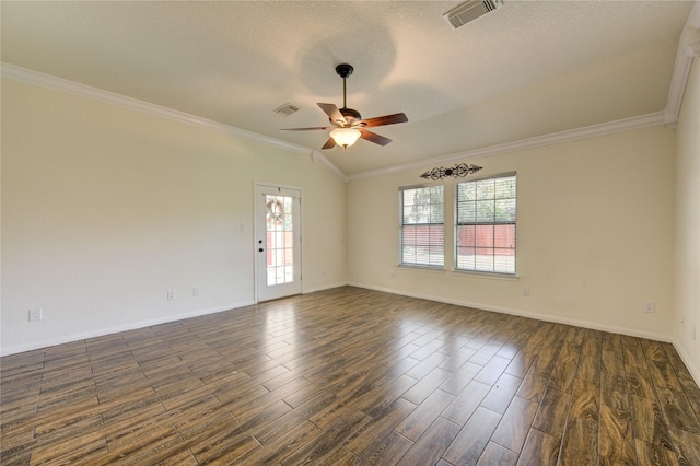 spare room with dark wood-type flooring, crown molding, and a wealth of natural light