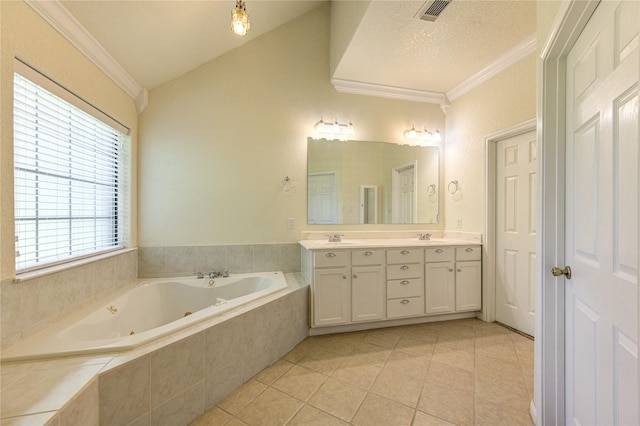 bathroom featuring vanity, tiled tub, crown molding, and tile patterned floors