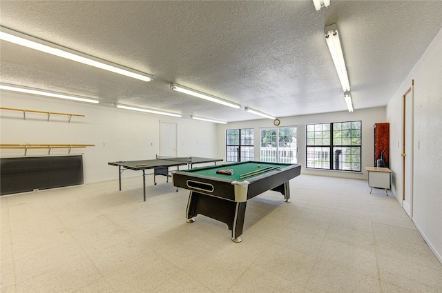 game room with billiards and a textured ceiling