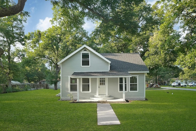 bungalow-style house featuring a front yard