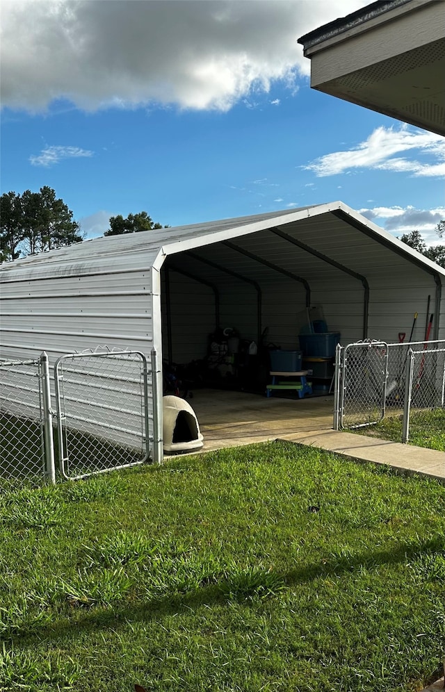 exterior space with a carport and a yard