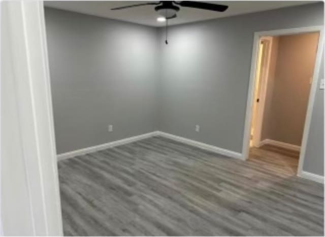 unfurnished room featuring ceiling fan and hardwood / wood-style floors