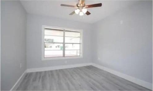 3437 Lydia St, Houston, TX 77021 - unfurnished room featuring baseboards, a ceiling fan, and wood finished floors