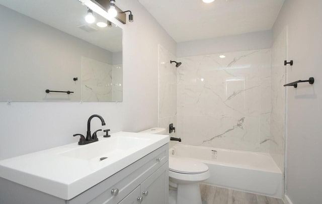 3437 Lydia St, Houston, TX 77021 - full bathroom featuring vanity, toilet, wood finished floors, and bathing tub / shower combination