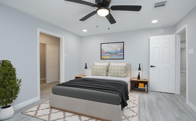 bedroom featuring ceiling fan and light wood-type flooring