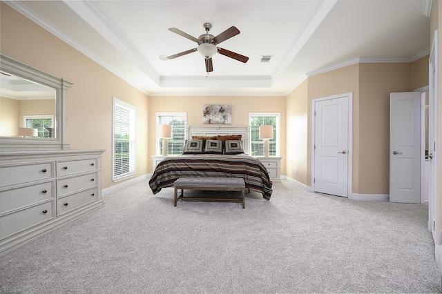 carpeted bedroom with access to exterior, ceiling fan, a raised ceiling, and crown molding