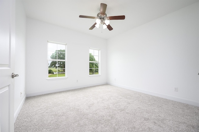 spare room with carpet flooring and ceiling fan