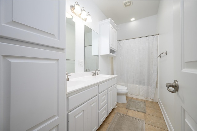 full bathroom featuring tile patterned flooring, vanity, toilet, and shower / bathtub combination with curtain