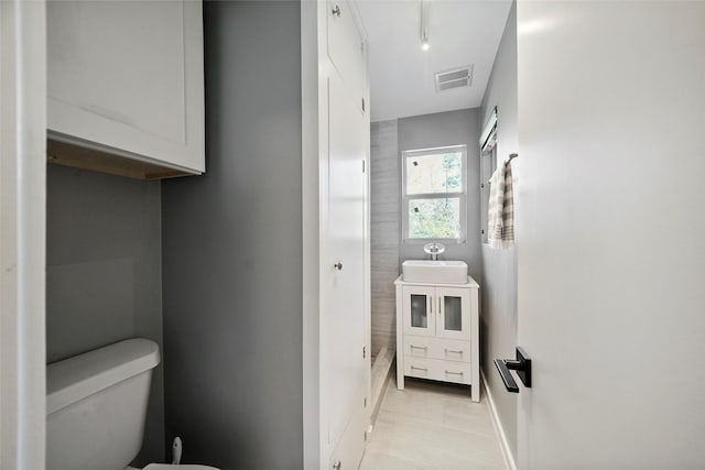 bathroom featuring sink and toilet