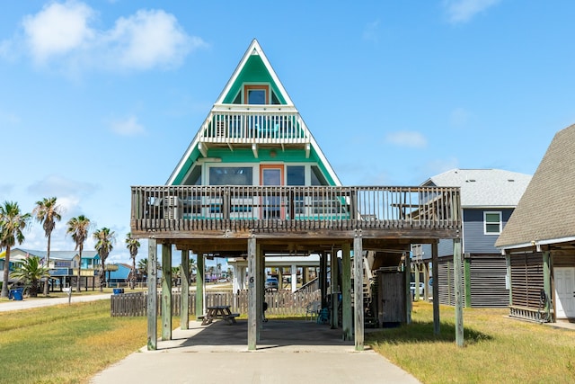 exterior space featuring a front yard and a carport