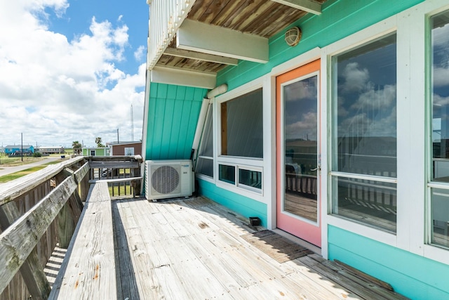 312 Angel Wing, Surfside Beach, TX 77541 - view of wooden balcony with ac unit and a deck