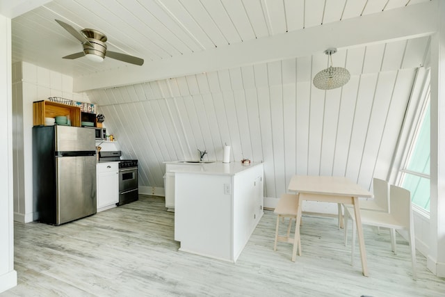 312 Angel Wing, Surfside Beach, TX 77541 - kitchen with stainless steel appliances, a peninsula, light wood finished floors, ceiling fan, and a sink