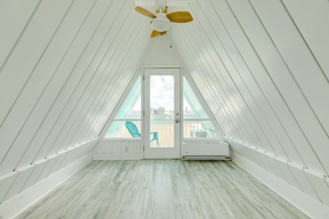 bonus room with ceiling fan and light wood-type flooring