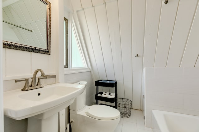 bathroom with tile floors, sink, and toilet