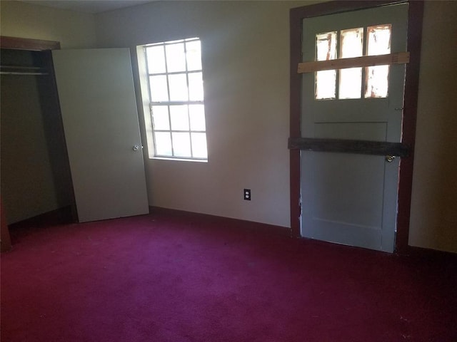 view of carpeted foyer