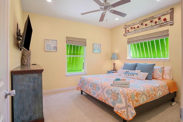 carpeted bedroom featuring ceiling fan