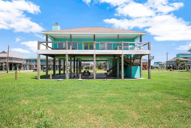 122 Ocean View Dr, Crystal Beach, TX 77650 - back of house featuring a lawn, a chimney, and stairs