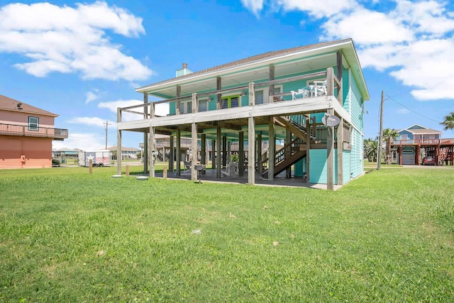 back of house featuring a lawn