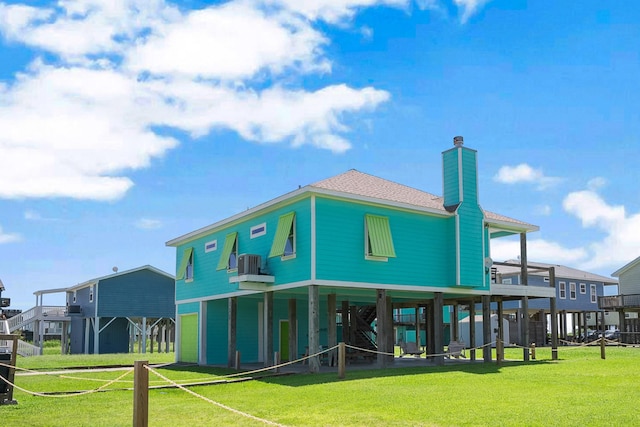 back of house featuring a lawn