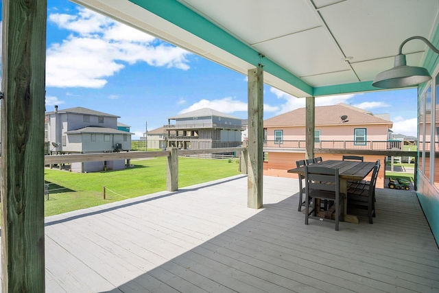 122 Ocean View Dr, Crystal Beach, TX 77650 - deck featuring a residential view, outdoor dining space, and a yard