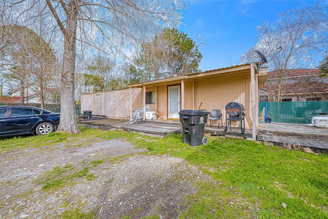 view of front of home featuring a wooden deck