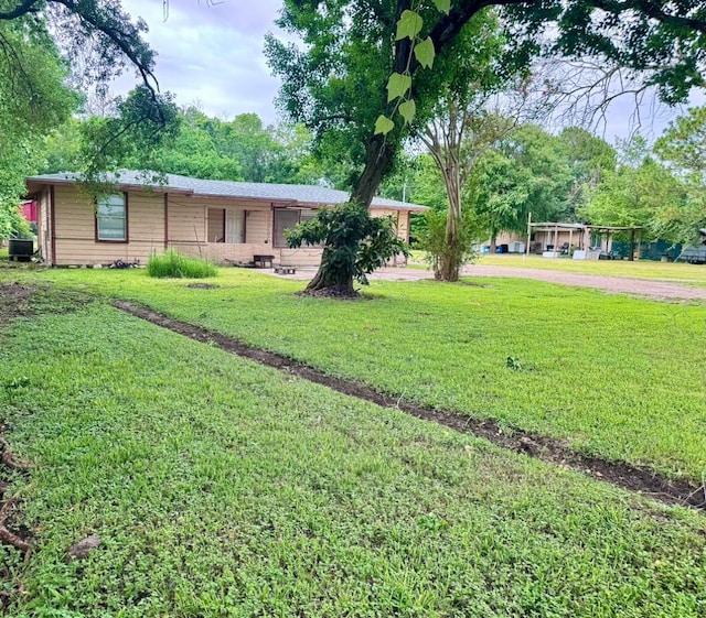 view of yard featuring central AC