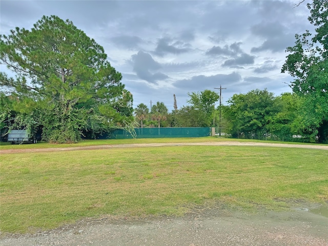 view of property's community with a yard