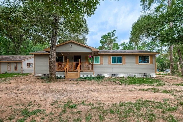 single story home with a porch