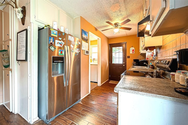 kitchen with dark hardwood / wood-style floors, sink, stainless steel fridge, and ceiling fan