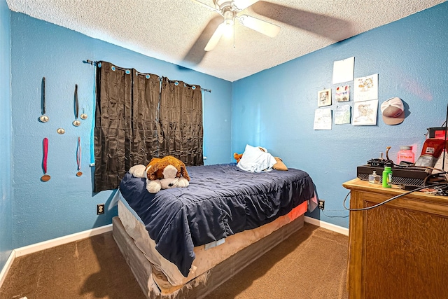 carpeted bedroom with ceiling fan and a textured ceiling