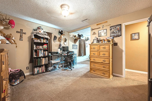 carpeted office space with a textured ceiling