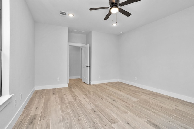 unfurnished room with ceiling fan and light hardwood / wood-style flooring