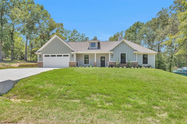 craftsman inspired home with a garage and a front lawn