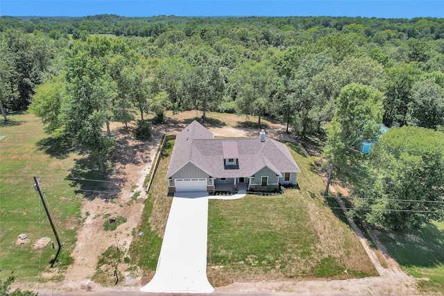 651 Paradise Dr, Coldspring, TX 77331 - view of subject property with a forest