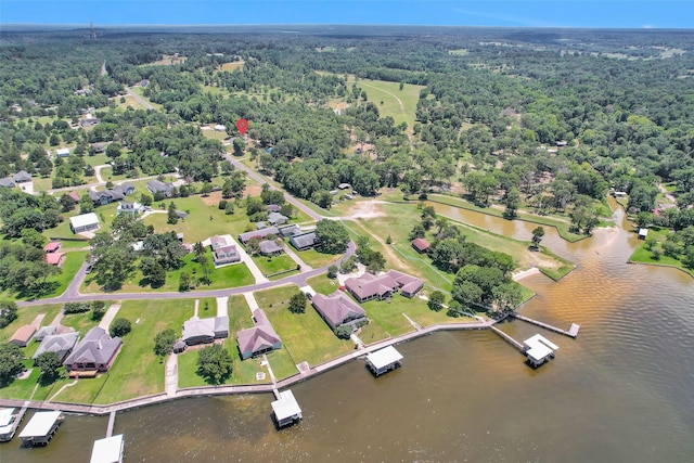 651 Paradise Dr, Coldspring, TX 77331 - aerial view of property and surrounding area featuring a nearby body of water and a forest