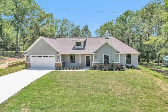 view of front of property featuring a garage and a front yard