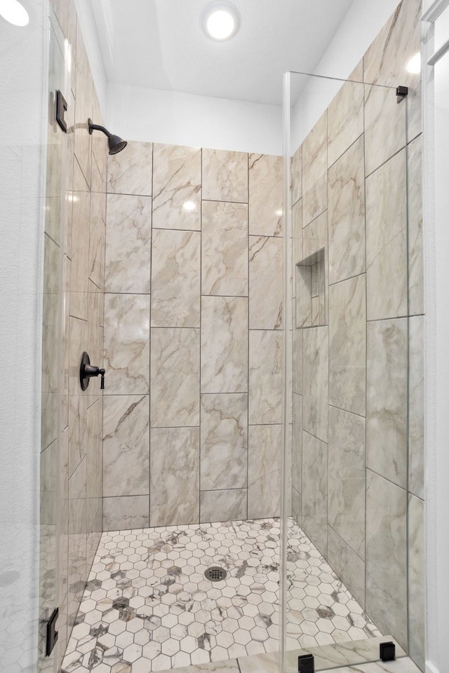 bathroom featuring an enclosed shower