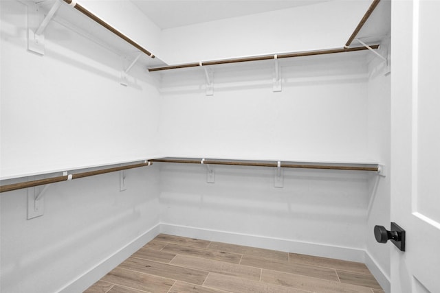 651 Paradise Dr, Coldspring, TX 77331 - spacious closet with light wood-type flooring