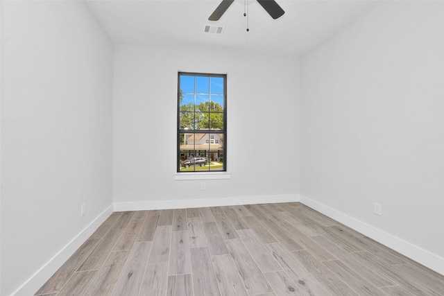 651 Paradise Dr, Coldspring, TX 77331 - unfurnished room with ceiling fan, light wood finished floors, and baseboards