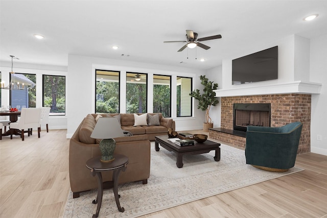 651 Paradise Dr, Coldspring, TX 77331 - living room with baseboards, wood finished floors, ceiling fan, a chandelier, and recessed lighting