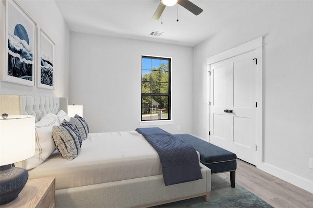 bedroom featuring hardwood / wood-style floors and ceiling fan