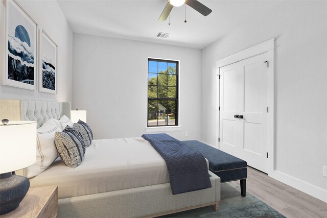 651 Paradise Dr, Coldspring, TX 77331 - bedroom featuring wood finished floors, baseboards, and a ceiling fan