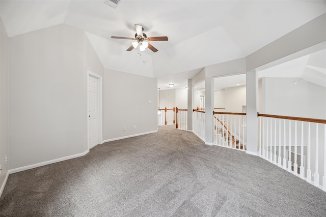 unfurnished room with carpet floors, ceiling fan, and vaulted ceiling