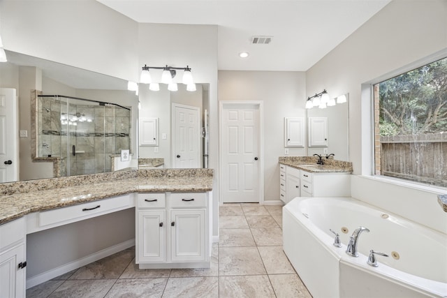 bathroom featuring tile floors, double sink vanity, and independent shower and bath